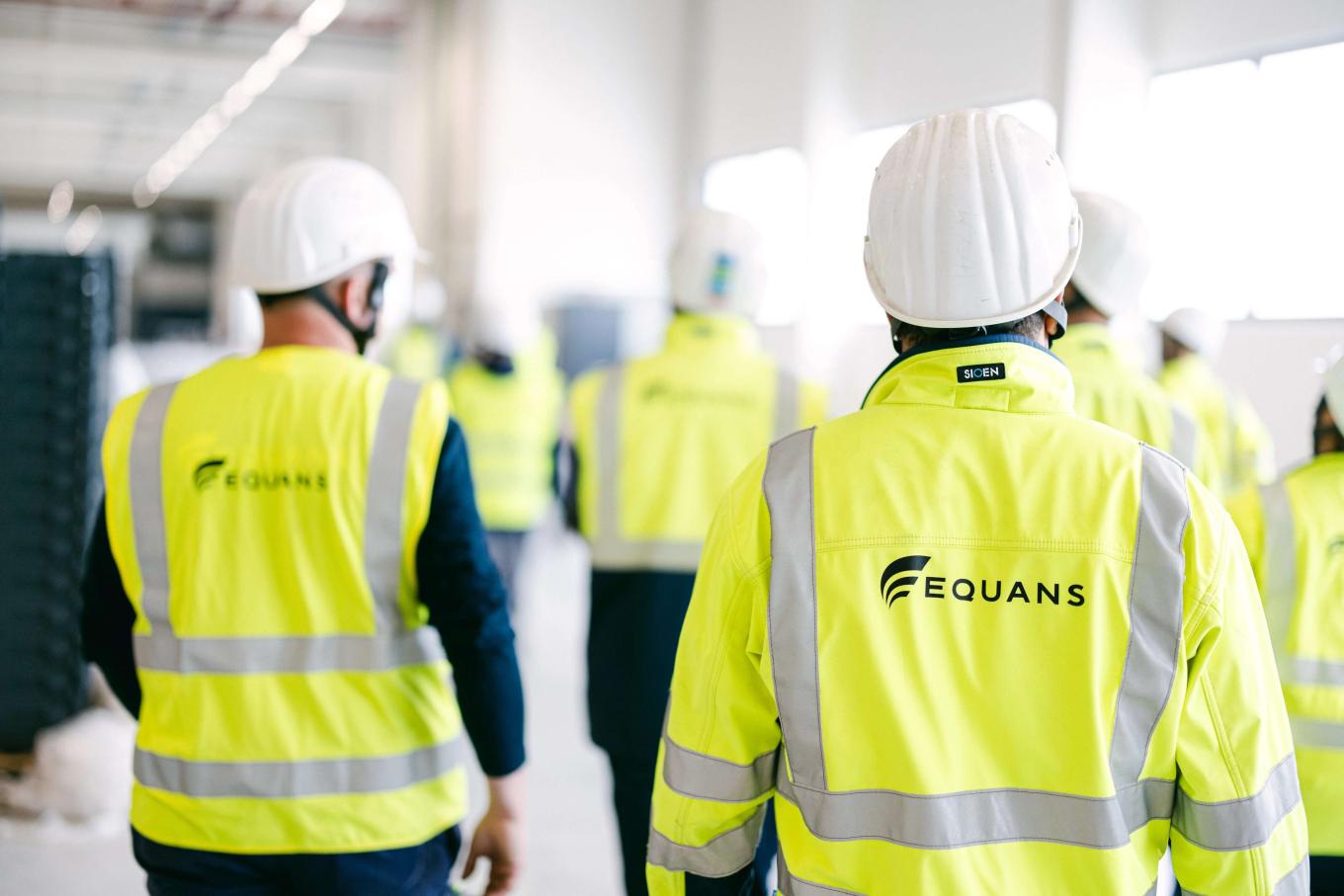 Men in Equans vests